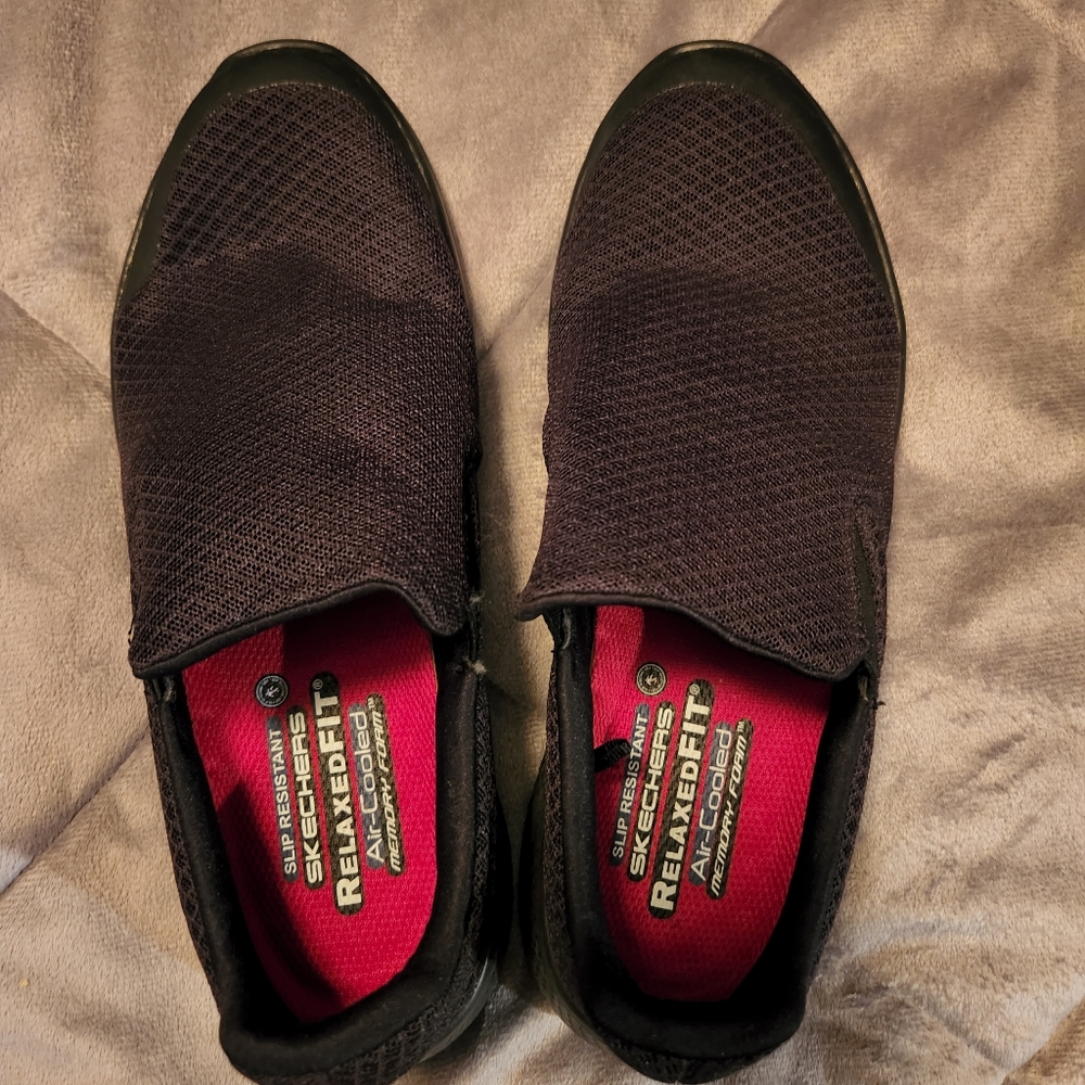 Lightly worn Skechers size 8 women's black slip ons